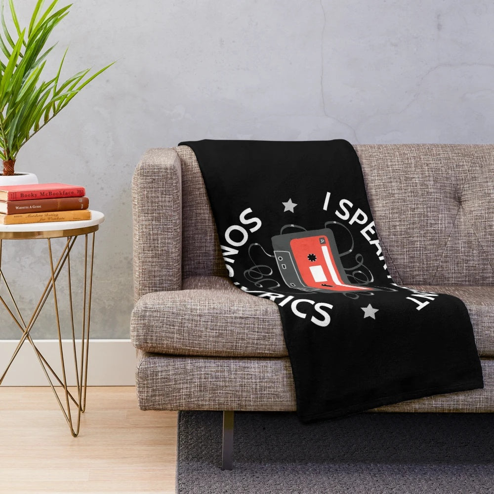 Plush blanket with "I Speak Fluent Song Lyrics" text and music-themed design