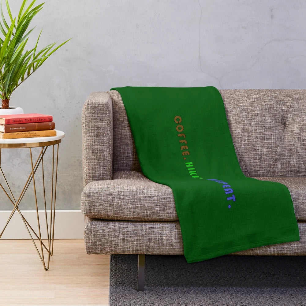 Cozy plush blanket with "Coffee. Hike. Repeat." design