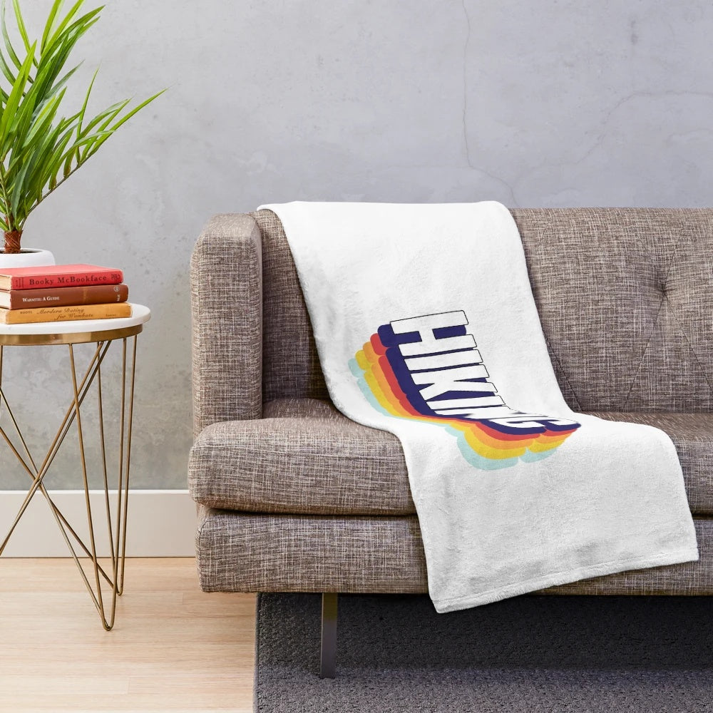 Plush hiking blanket with colorful, vintage-inspired design