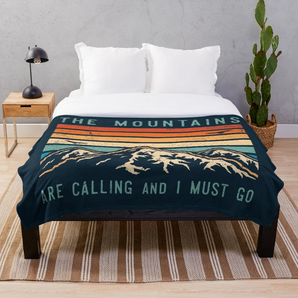 Plush blanket featuring a retro mountain design