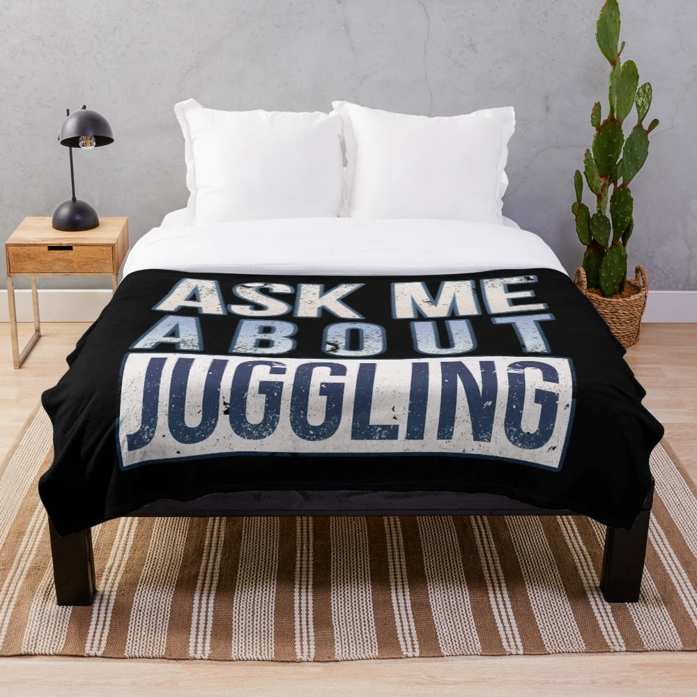 Plush blanket with a juggling design and text