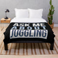 Plush blanket with a juggling design and text