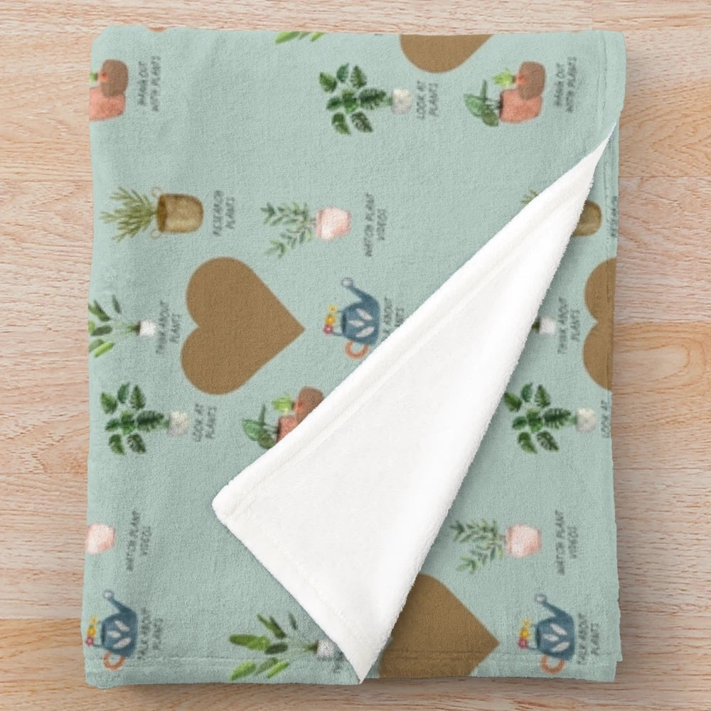 Plush blanket with a floral and botanical design for plant lovers