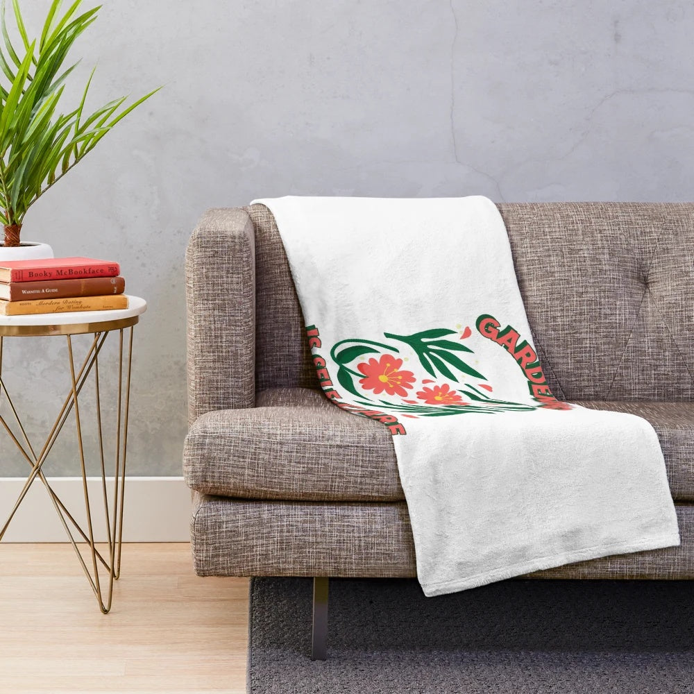 Plush blanket with "Gardening is Self-Care" quote and floral design