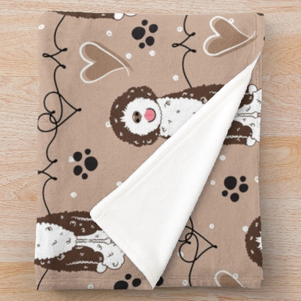 Soft and cuddly plush blanket featuring a cute Portuguese Water Dog on a brown background