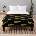 Plush blanket for radio listeners with NPR, news, sports, and music designs