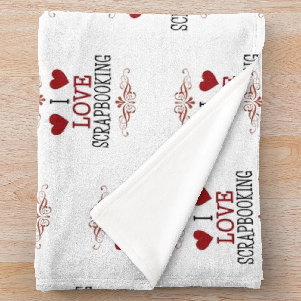 Soft white plush blanket with 'I Love Scrapbooking' text for scrapbooking enthusiasts