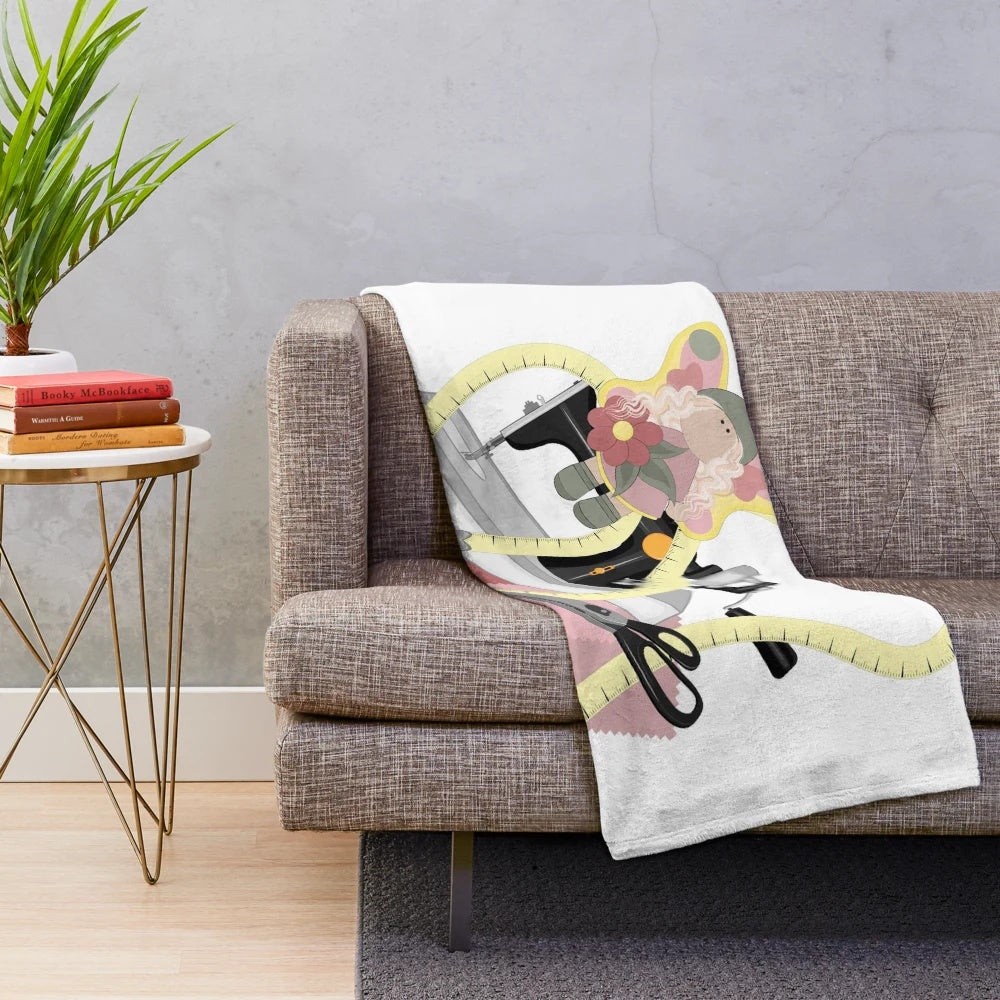 Plush blanket with sewing machine, scissors, and doll motif
