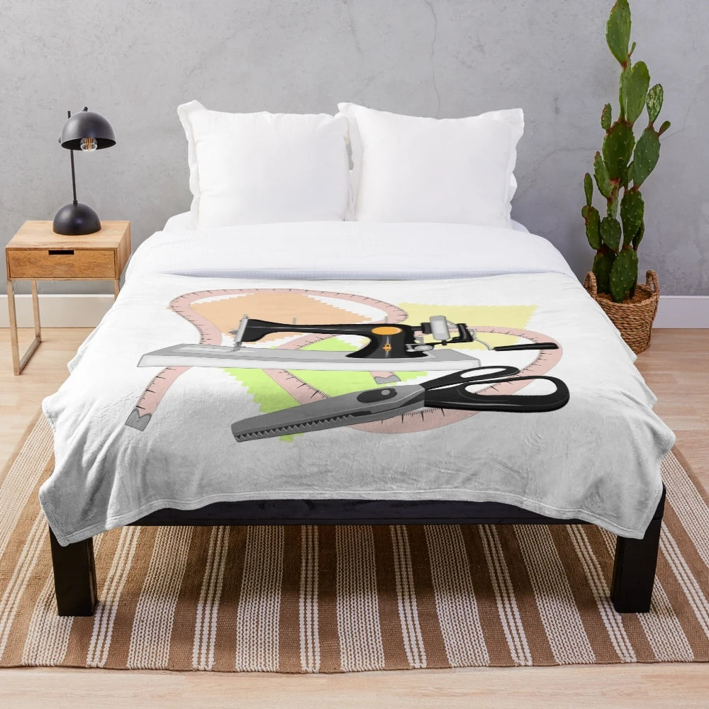 Plush blanket with sewing machine, scissors, and shreds design