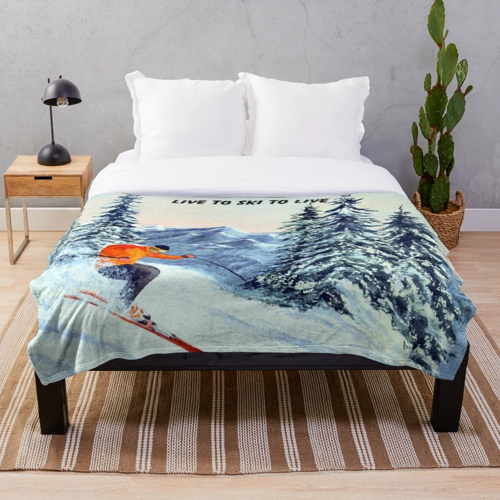Plush blanket with "Live to Ski to Live" design