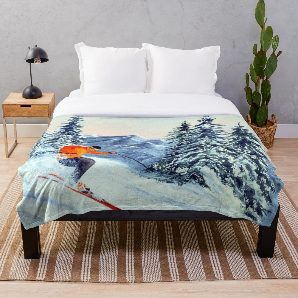 Skiing-themed plush blanket featuring snow-capped mountains and ski icons