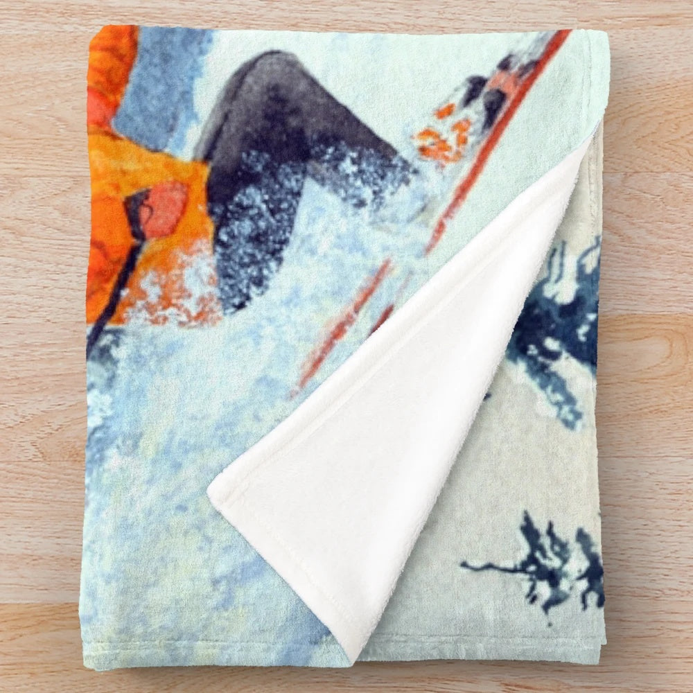 Skiing-themed plush blanket featuring snow-capped mountains and ski icons