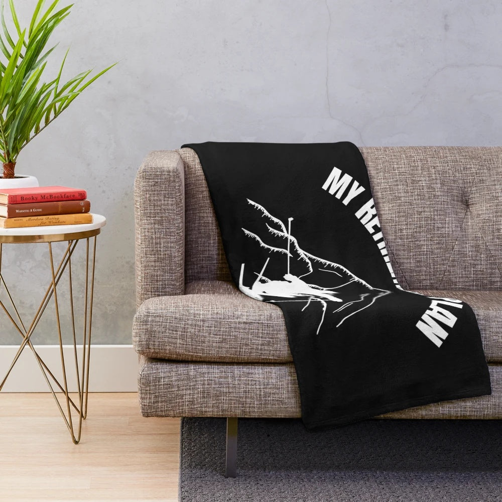 Plush blanket with "My Retirement Plan is Skiing" text and winter sports imagery
