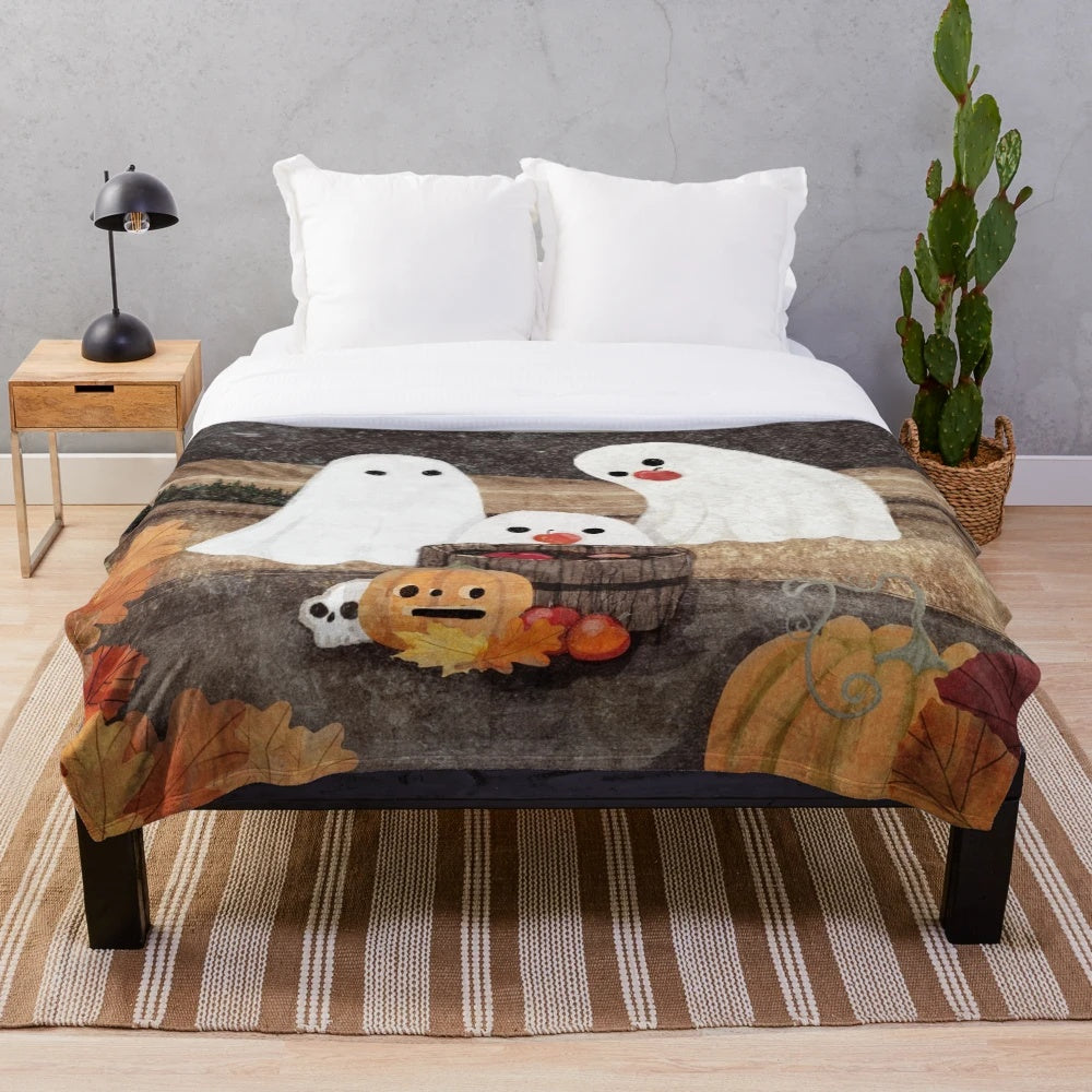 Plush blanket with ghostly apple bobbing design