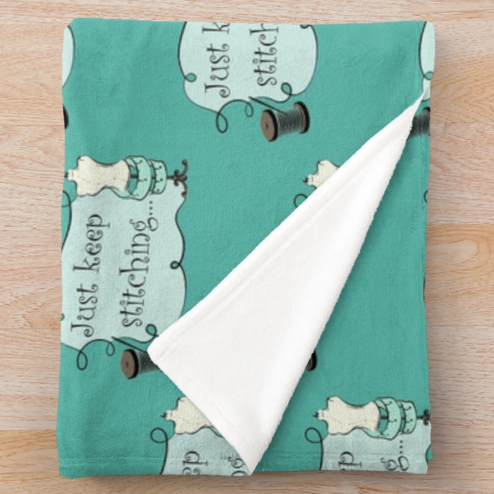 Plush blanket with stitched design
