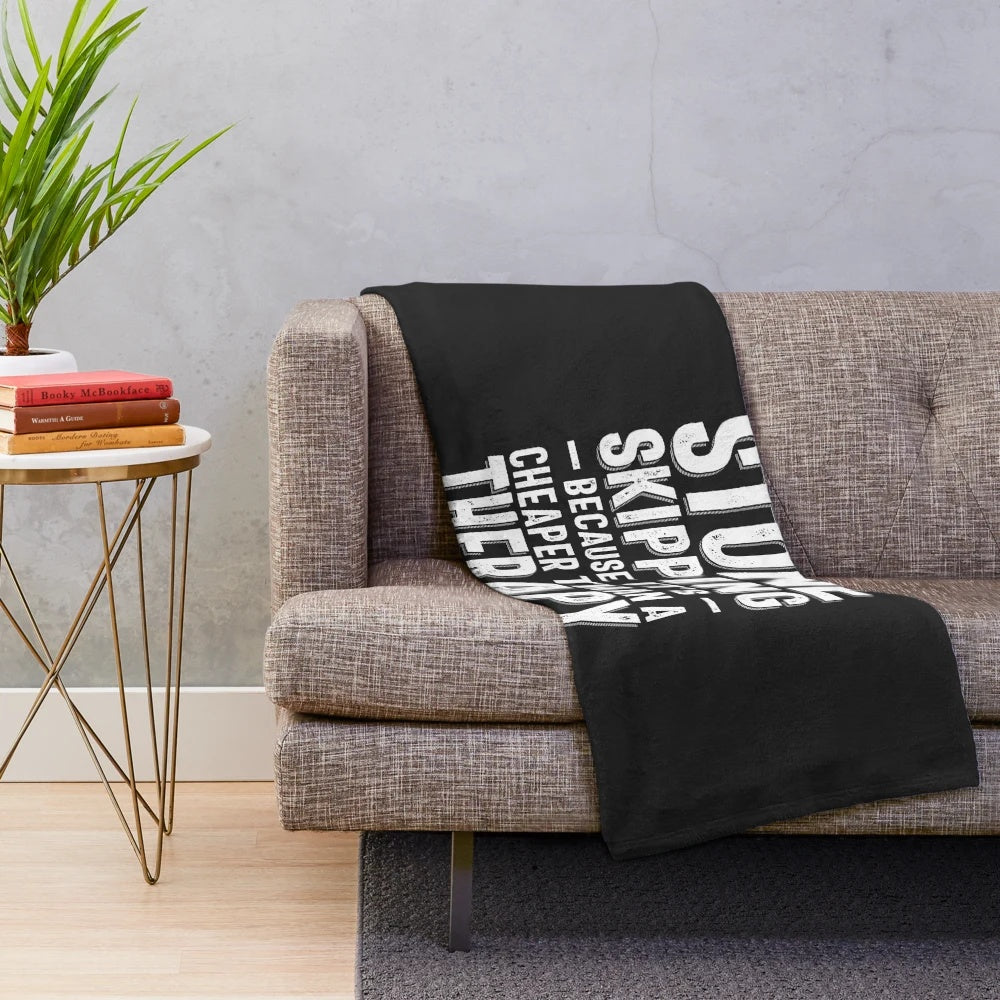 Plush blanket with a stone skipping design and the text "Cheaper Than a Therapy