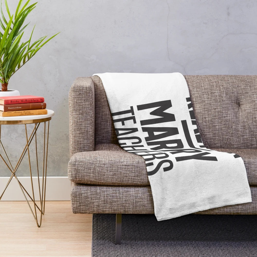 Plush blanket with the text "Real Men Marry Teachers