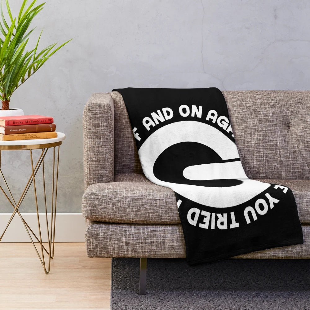 Plush blanket with "Have You Tried Turning It Off And On Again?" text