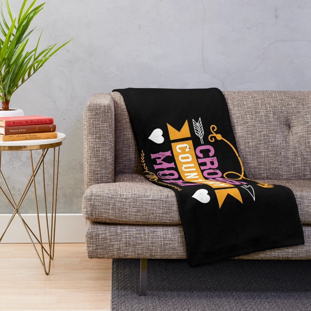 A soft and warm plush blanket featuring a design for the active and adventurous cross country mom