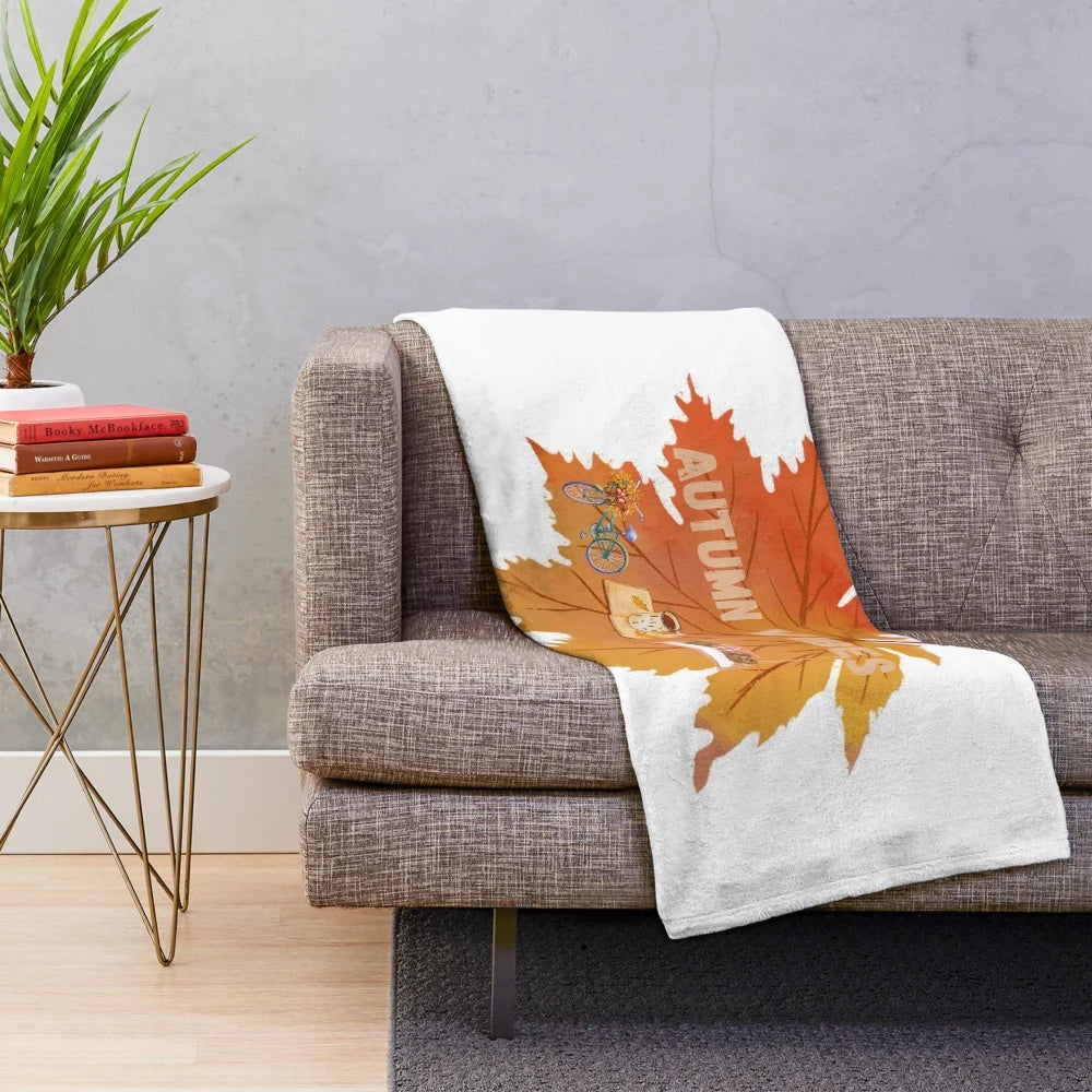 Soft and plush autumn-inspired blanket with leaf pattern