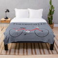 Plush blanket featuring a red bicycle design for bike lovers