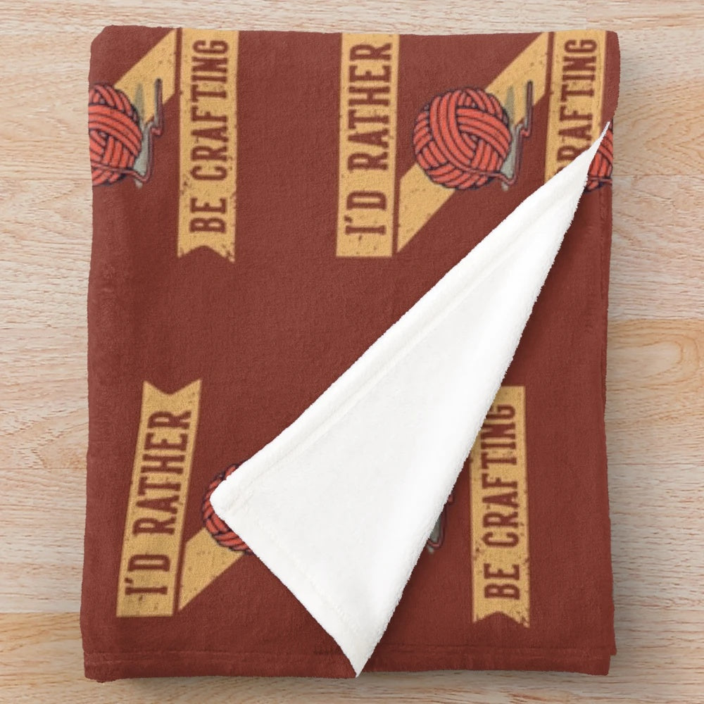 Cozy plush blanket with the text "I'd Rather Be Crafting