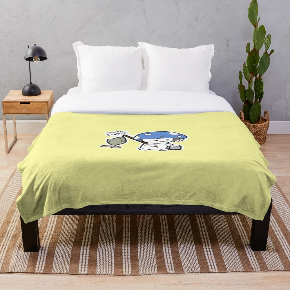 Plush blanket with a fishing design