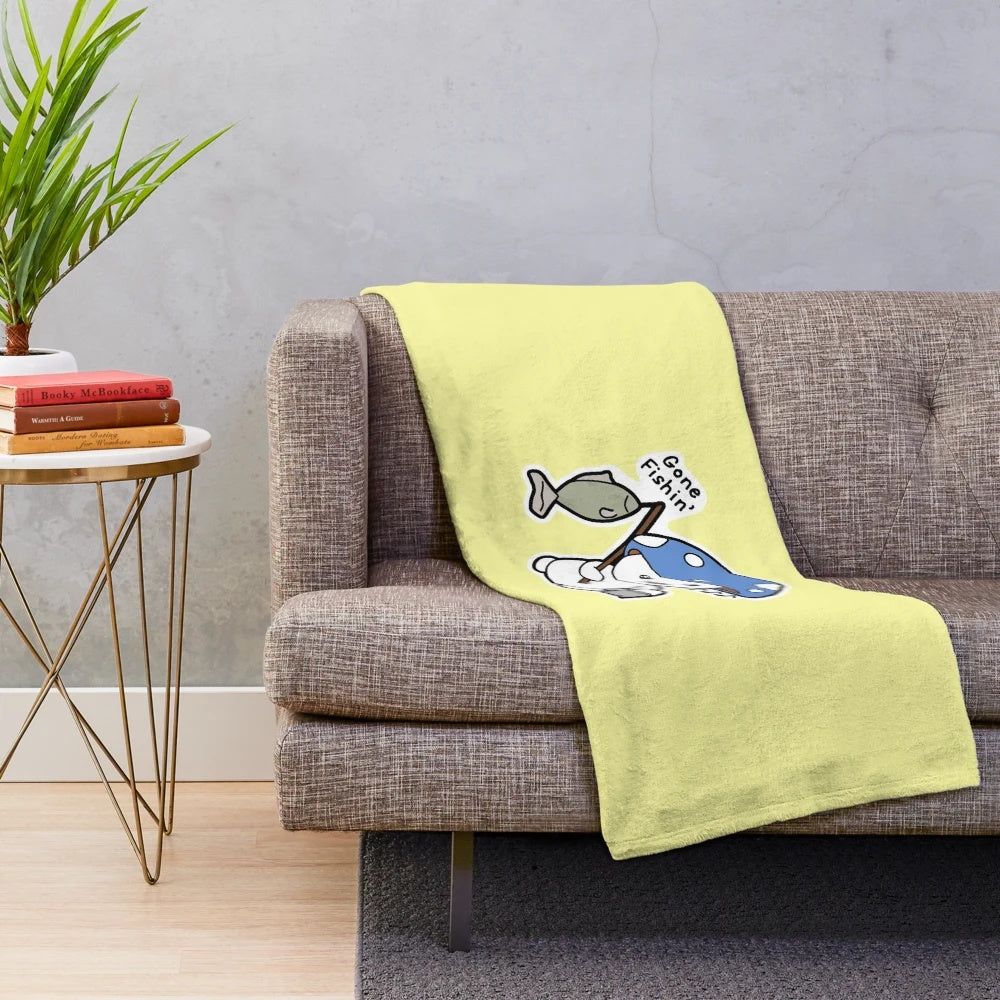 Plush blanket with a fishing design