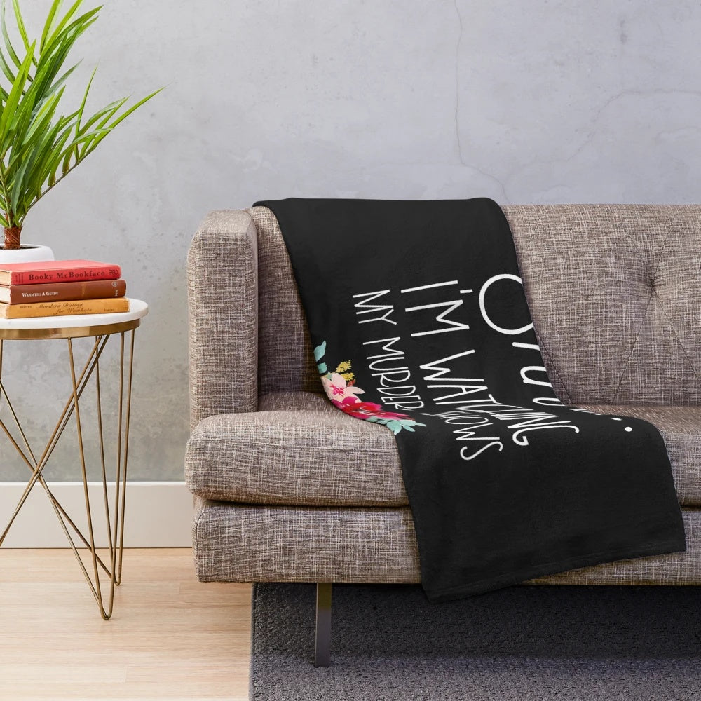 Plush blanket with "Shhh, I'm Watching My Murder Shows" text for true crime fans