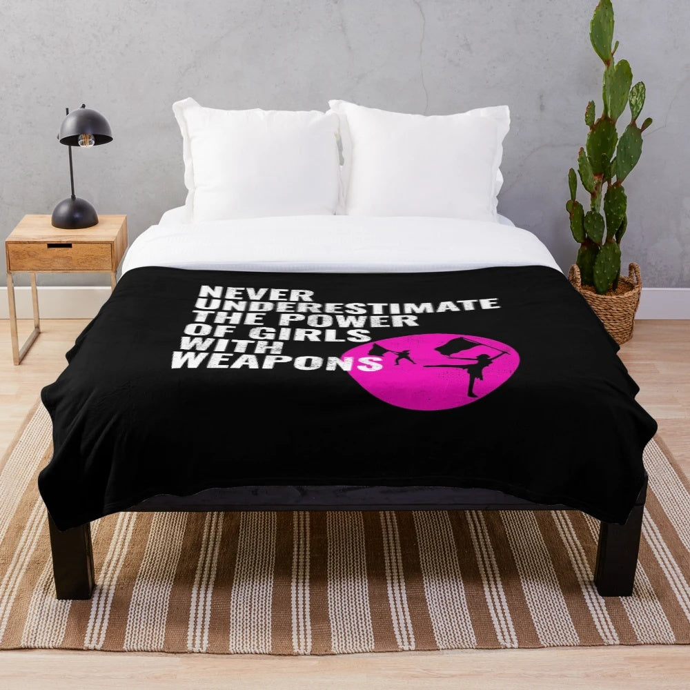 Plush blanket featuring a winter guard dancer design
