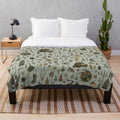 Cozy plush blanket with witchy, gothic, and occult nature-inspired design