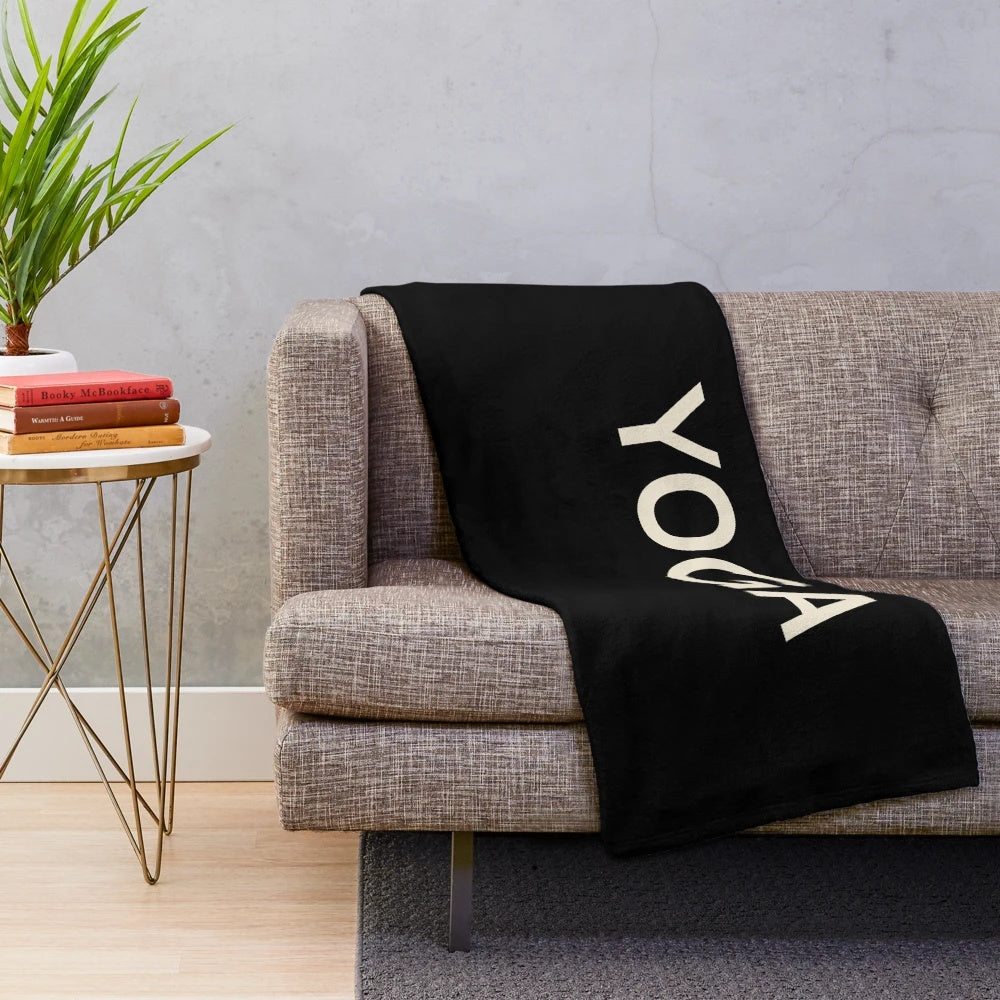 Cozy plush blanket featuring yoga-themed design