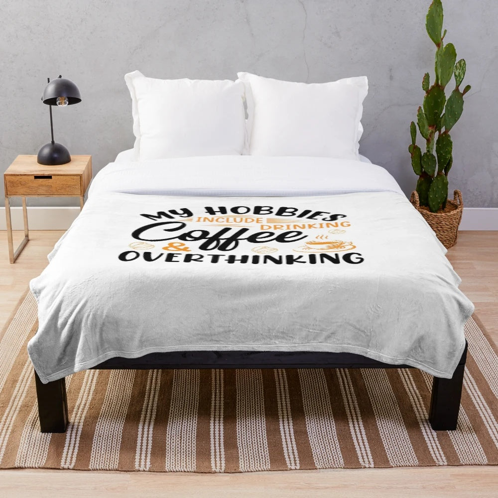 Plush blanket with "My hobbies include drinking coffee and overthinking" design