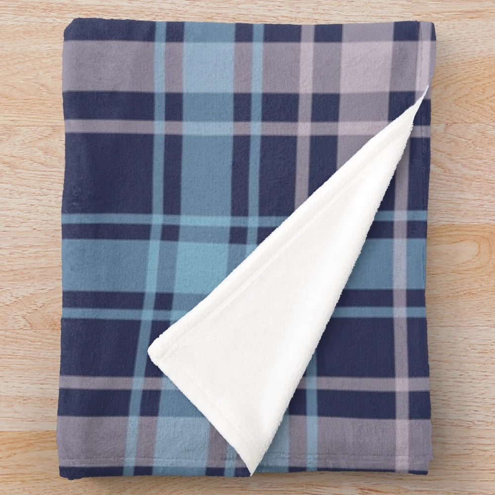 Soft and warm plush blanket featuring a classic Scottish tartan pattern in shades of grey and blue