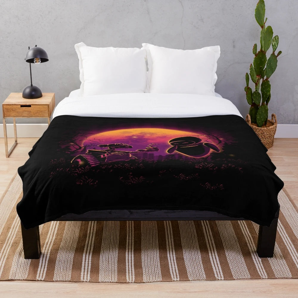 Plush blanket featuring the characters Wall-E and Eve from the Disney Pixar film