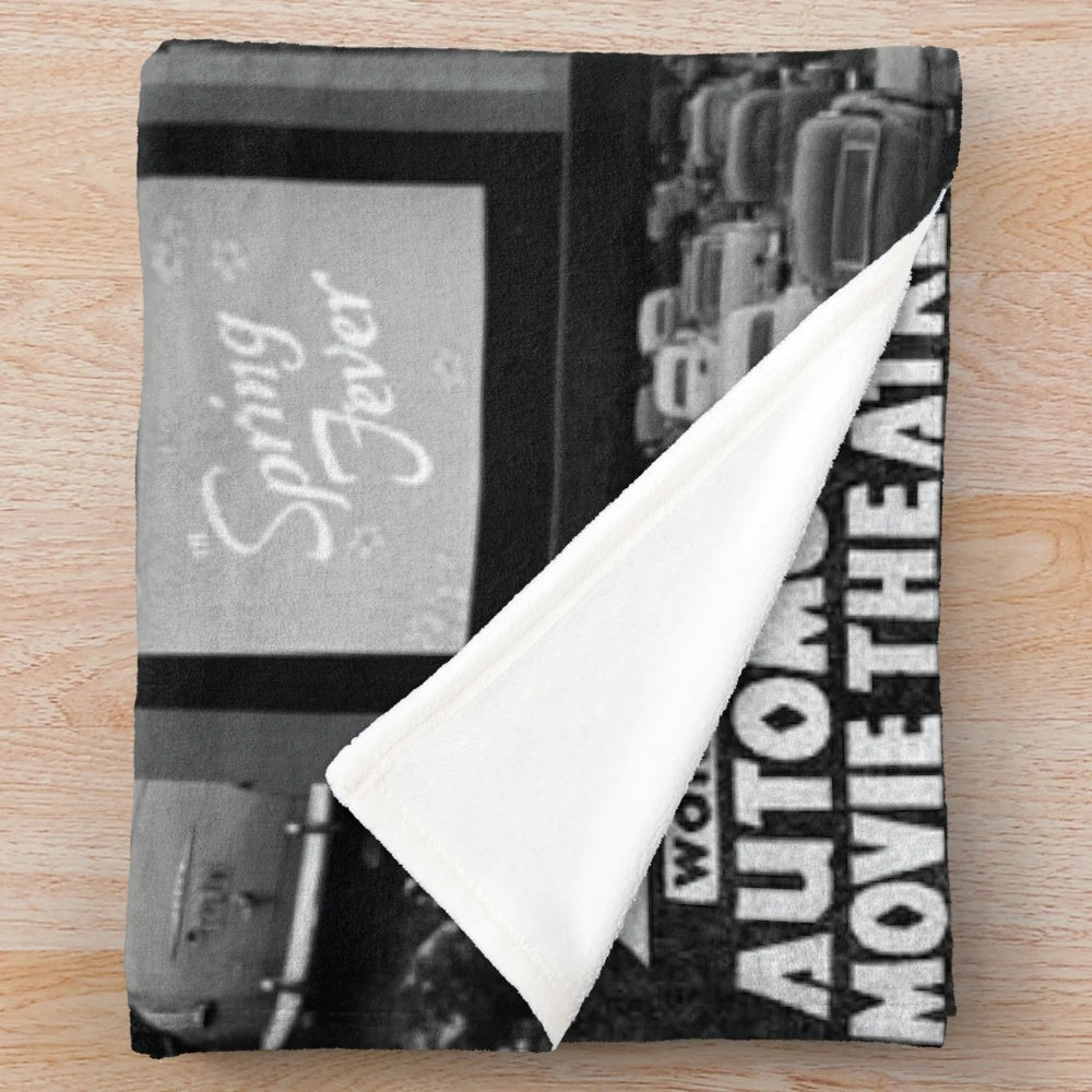 Plush blanket featuring a design inspired by classic drive-in cinema