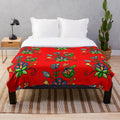 Plush blanket with floral and blue acrylic painting design inspired by indigenous and metis art from Saskatchewan
