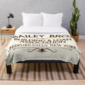 Plush blanket with Bailey Bros Building & Loan logo from the movie "It's a Wonderful Life
