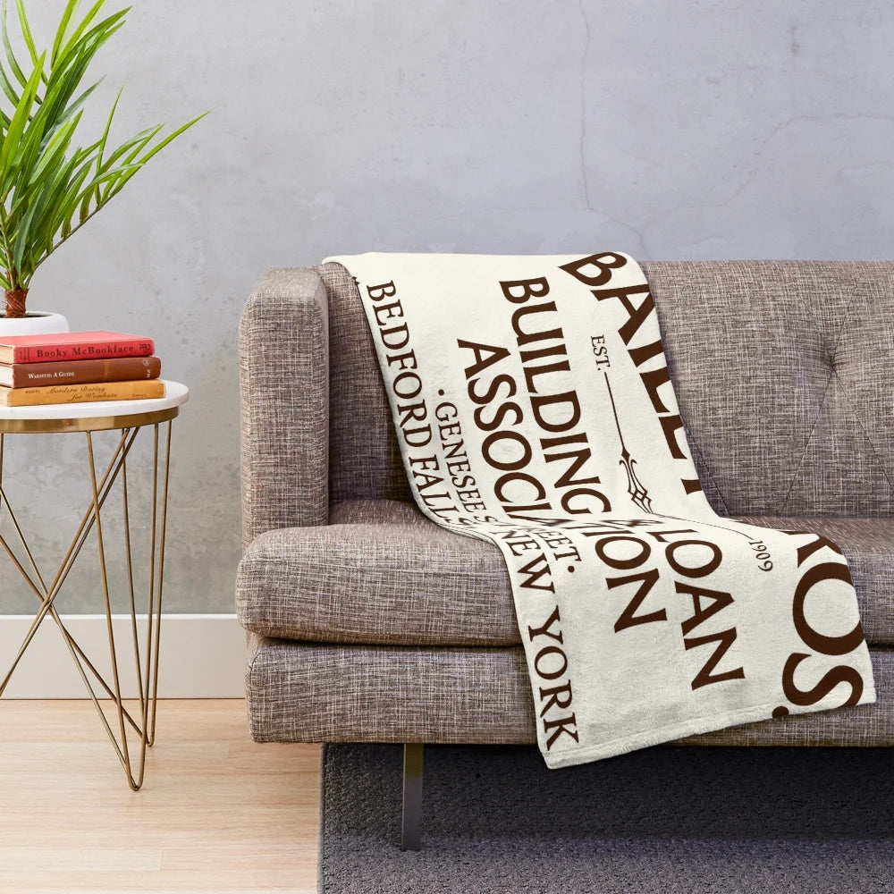 Plush blanket with Bailey Bros Building & Loan logo from the movie "It's a Wonderful Life