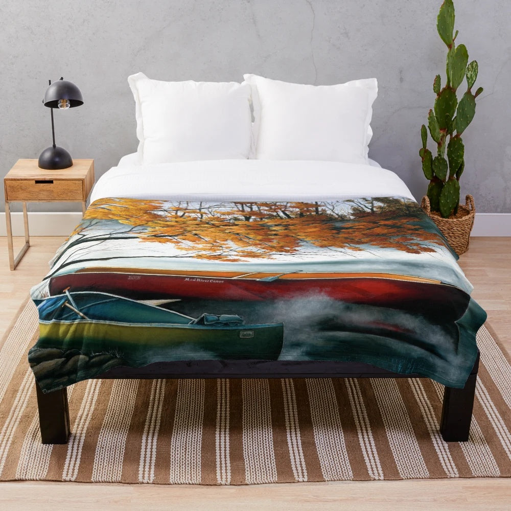 Plush blanket featuring artwork of a canoe on a river in autumn