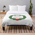 A cozy plush blanket featuring a design inspired by the classic holiday movie National Lampoon's Christmas Vacation