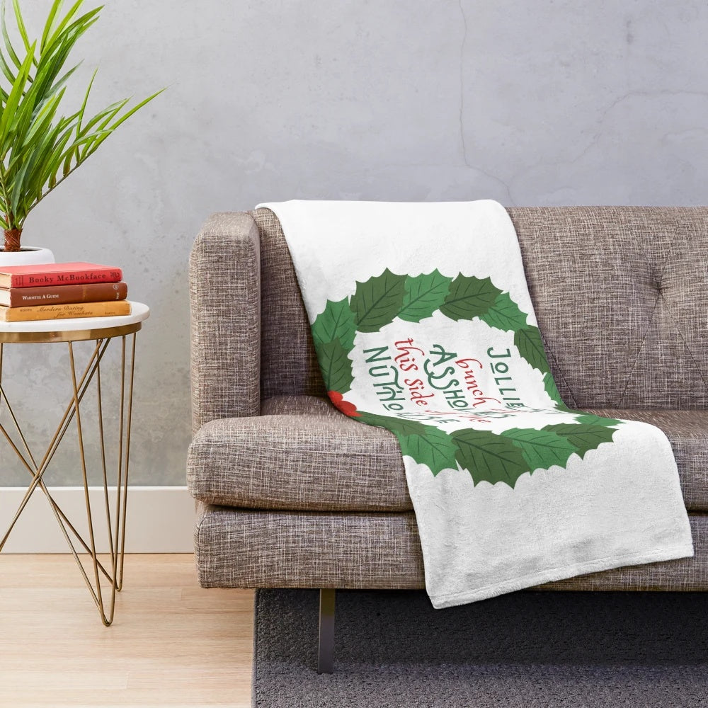 A cozy plush blanket featuring a design inspired by the classic holiday movie National Lampoon's Christmas Vacation