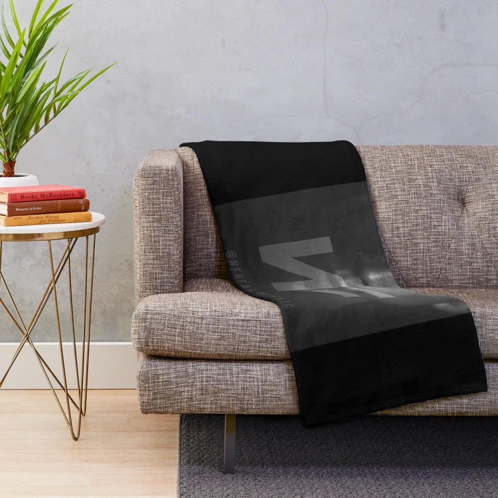 Plush blanket featuring the NF logo and design