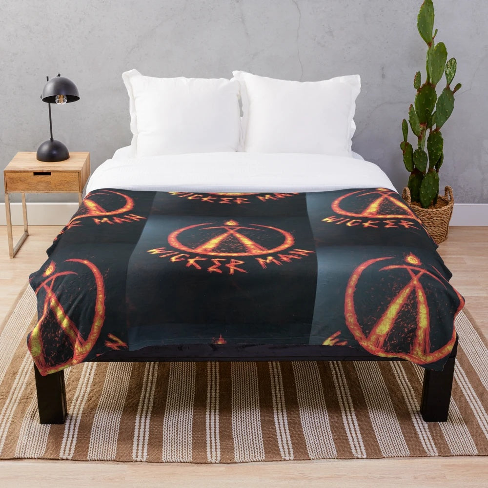 Plush blanket with wicker man and fire imagery, perfect for horror movie fans