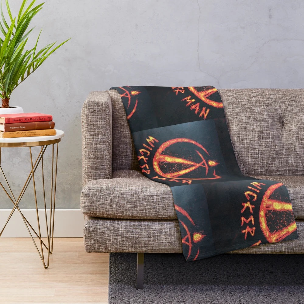 Plush blanket with wicker man and fire imagery, perfect for horror movie fans