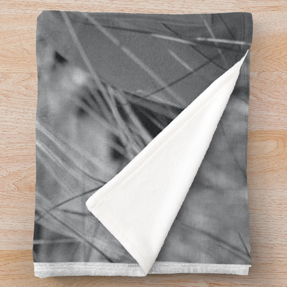 Soft, black and white plush blanket featuring film and movie elements