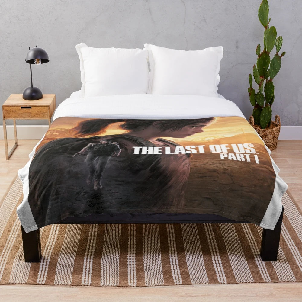 Plush blanket with The Last of Us inspired design featuring Ellie and Joel