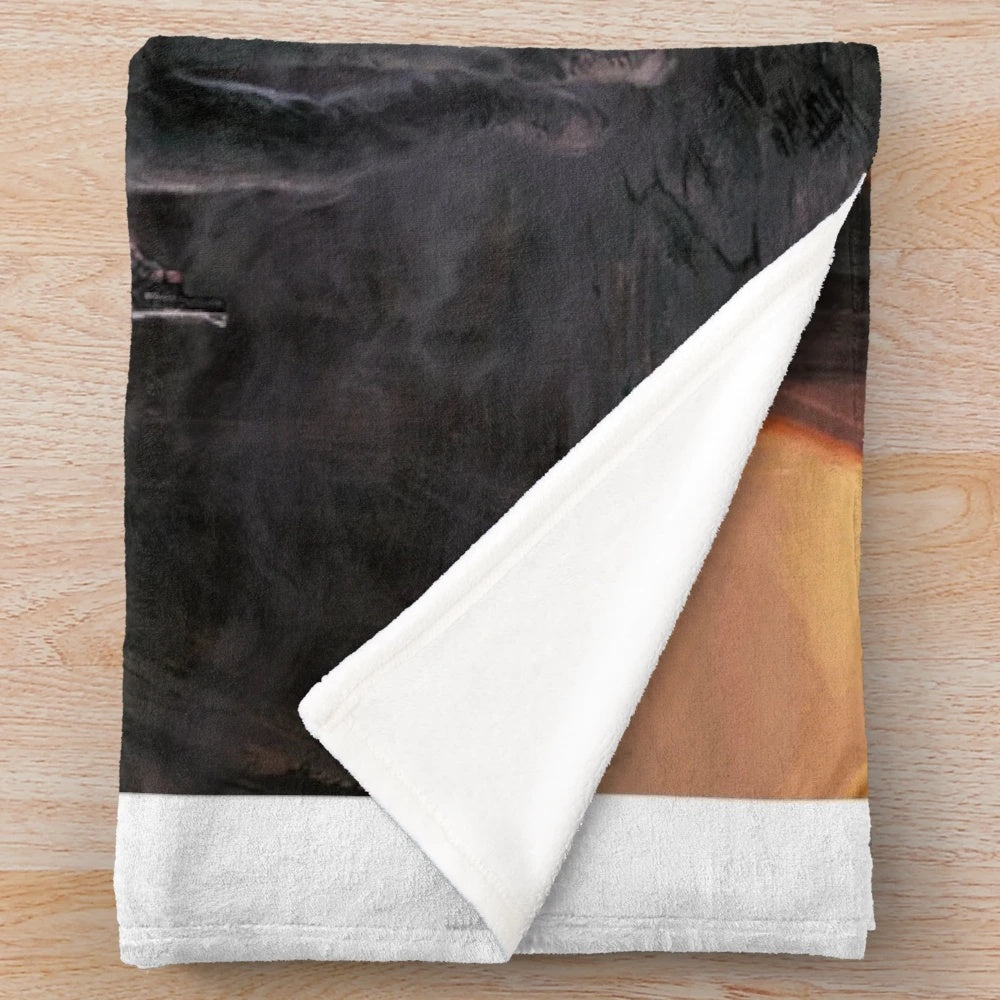 Plush blanket with The Last of Us inspired design featuring Ellie and Joel