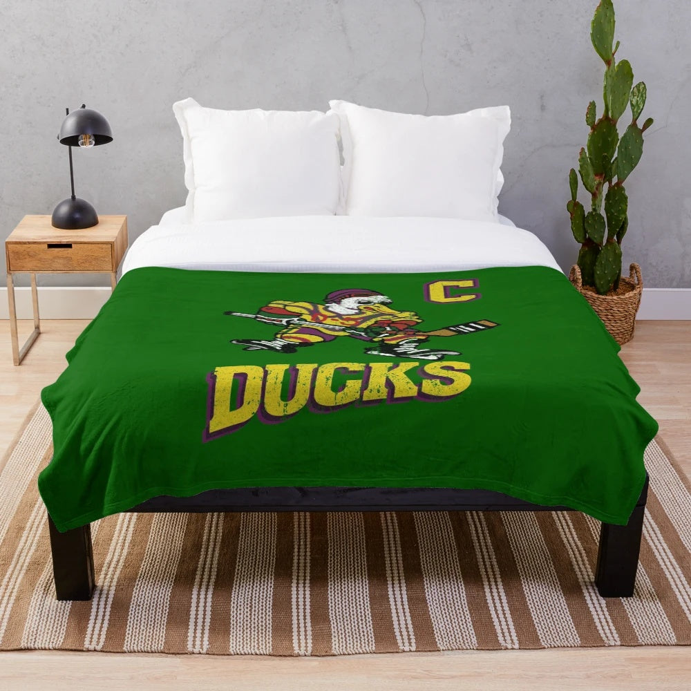 Plush blanket featuring The Mighty Ducks hockey team logo and jersey design
