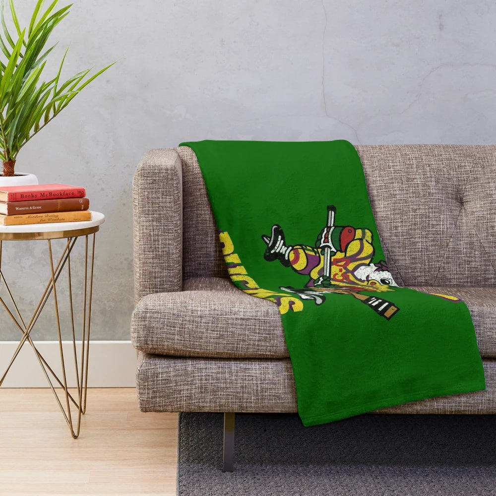 Plush blanket featuring The Mighty Ducks hockey team logo and jersey design